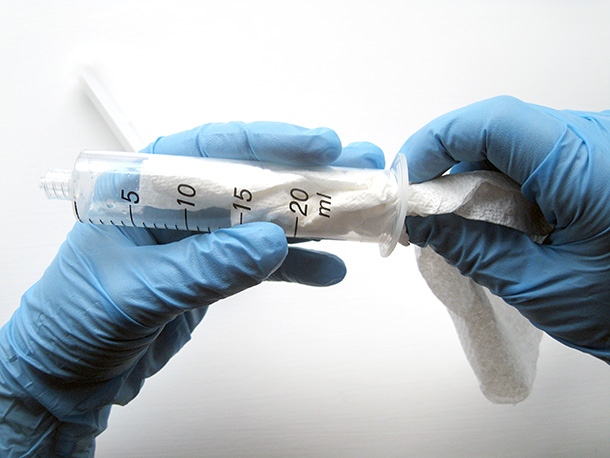 Drying inside of syringe with paper towel