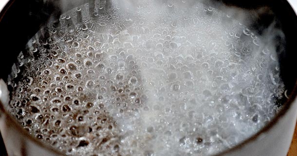 Boiling water in a pan