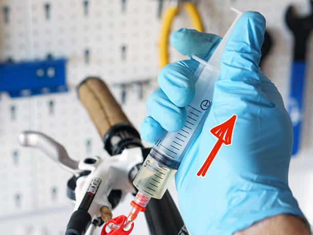 Avid Elixir R master cylinder bleed syringe during bleed procedure