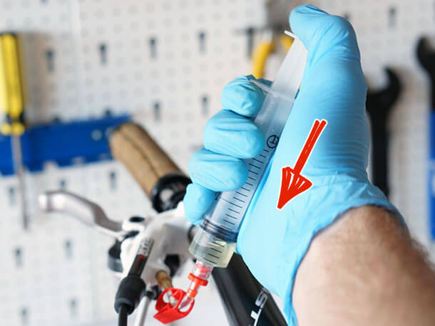 Avid master cylinder bleed syringe during bleed procedure