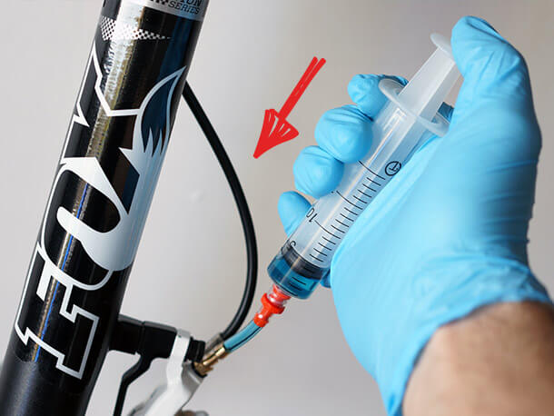 Injecting brake fluid with Magura MT4 calliper bleed syringe