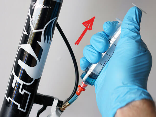 Performing a bleed of the Magura MT4 disc brake calliper with bleed syringe