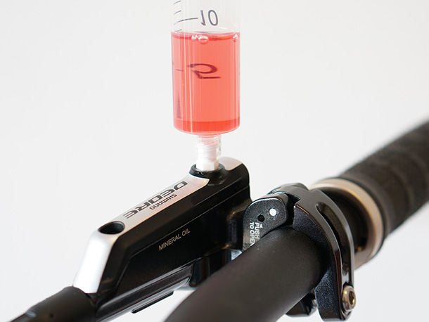 Shimano Deore lever bleed port and the Epic Bleed Solutions bleed adaptor/funnel