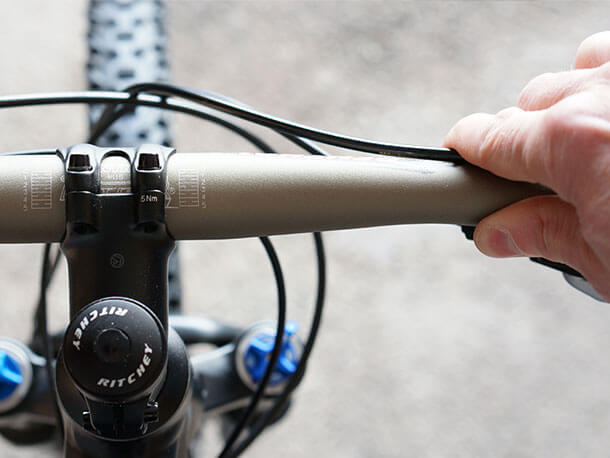 Holding Shimano brake hose against Renthal Fatbar Lite handlebar